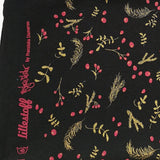 Reststück: schwarzer weihnachtlicher Bio Jersey Stoff mit rot goldenen Applikationen Blättern Zweigen Früchten, Weihnachten; ca. 1,2m