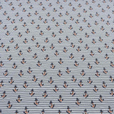 Baumwolljersey Stoff "Dina" Blütenanker, weiß mit lachsfarbenen Blüten, alten Ankern und Streifen