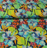 Viskosejersey Stoff - hellblaue und orangene Blüten, grüne Blätter auf dunkelblau